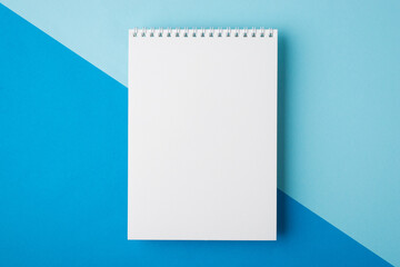 Top above overhead close up flat lay view photo of clear notebook with space for text design isolated half pastel and bright color backdrop