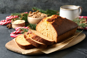 Fresh sliced gingerbread cake on grey table