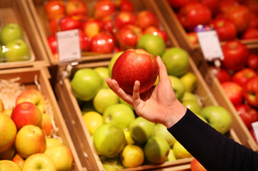  buying fruits and vegetables at the market.