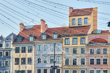 Fototapeta premium Facades of colorful buildings rebuilt after World War II on the Old Town Square in Warsaw, Poland