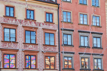 Anszultowska and Rolinska buildings fasade, rebuild after WWII in Warsaw old town square, Poland