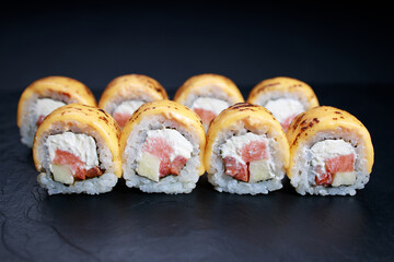 Spicy salmon and cheese grilled sushi rolls