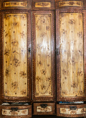 Antique Soviet wooden wardrobe with three doors and drawers