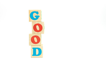 word good made of colored cubes on white background