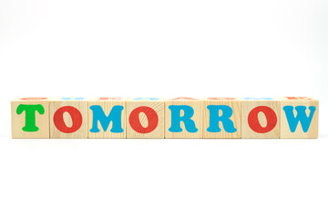 word tomorrow made of colored cubes on white background
