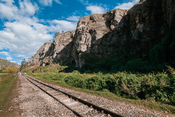 Fototapeta premium Old Railway with rocky mountains and stone walls on a sunny day in Suesca, Cundinamarca - Colombia