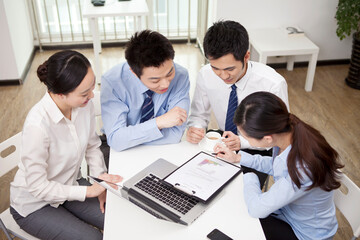 Group of business people discussing in office