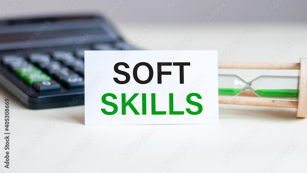 Poster business concept. notebook with text soft skills sheet of white paper for notes, calculator, hourgla
