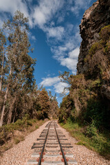 Obraz premium Old Railway with rocky mountains and stone walls on a sunny day in Suesca, Cundinamarca - Colombia