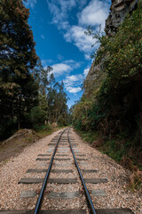 Obraz premium Old Railway with rocky mountains and stone walls on a sunny day in Suesca, Cundinamarca - Colombia