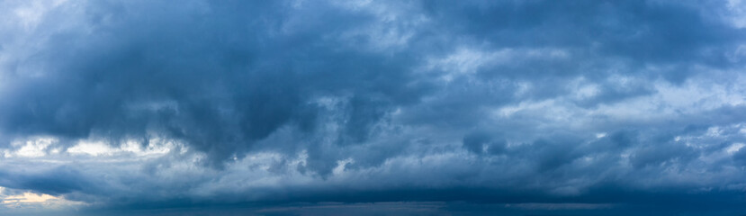 Fototapeta premium Stormy sky panorama with blue clouds before the rain. Weather forecast concept.