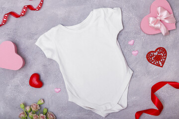 Children's clothing mock up flat lay with decor for the Valentine's Day for logos and texts
