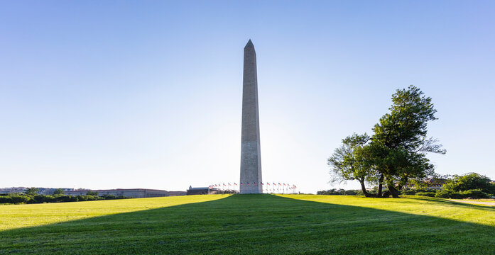 USA, Washington DC, Washington Monument casting long shadow on surrounding lawn