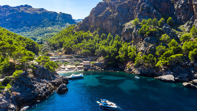 Scenic view of sea with rock mountains on sunny day, Torrent De Pareis, Sierra De Tramuntana, Mallorca, Balearic Islands, Spain
