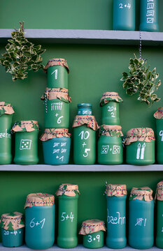 DIY green painted jars representing Advent Calendar