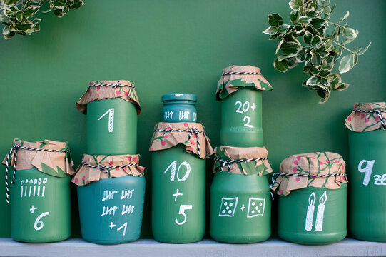 DIY¬†green painted jars representing Advent Calendar