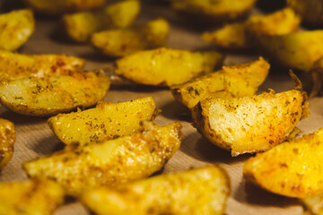 Baked potatoes in the oven close-up