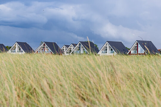 Grass in front of rows of holiday houses