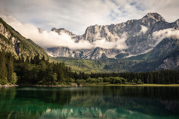 Lake and cloud covered mountains