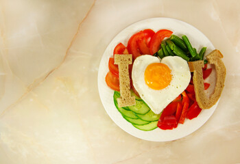 healthy breakfast with egg, bread, tomatoes slice, cucumber slice, and green beans for Valentine's day morning