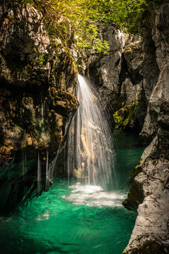 Turquoise river and waterfall