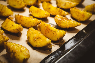 Baked potatoes in the oven close-up