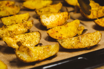 Baked potatoes in the oven close-up