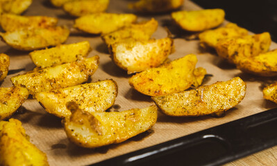 Baked potatoes in the oven close-up