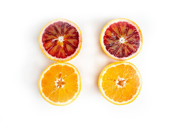 red and yellow sicilian oranges cutaway top view isolate on white