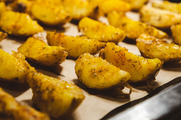 Baked potatoes in the oven close-up