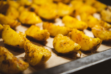 Baked potatoes in the oven close-up