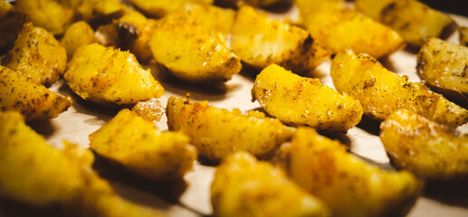 Baked potatoes in the oven close-up