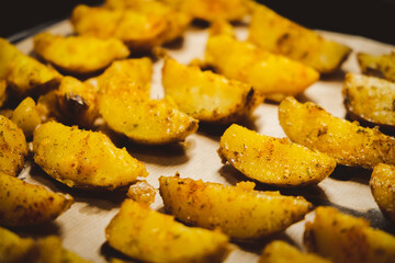 Baked potatoes in the oven close-up