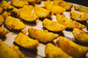 Baked potatoes in the oven close-up