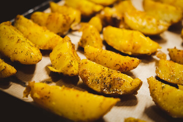 Baked potatoes in the oven close-up