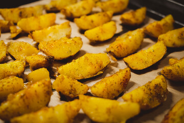 Baked potatoes in the oven close-up