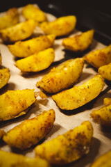 Baked potatoes in the oven close-up