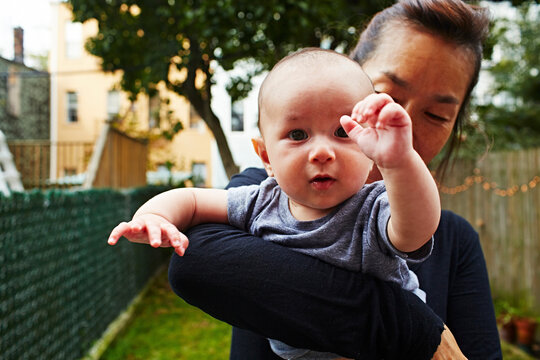 Grandmother holding baby grandson
