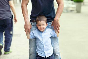 Father and son holding hands