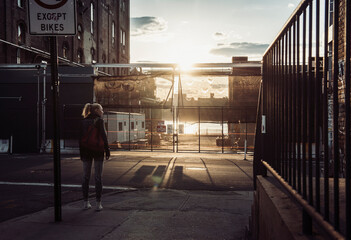 Woman by road, Williamsburg, Brooklyn, New York, USA