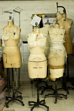 Undressed tailors dummies in fashion design studio