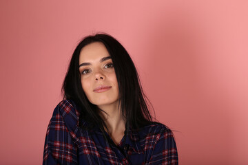 Fototapeta premium Beautiful brunette woman on pink background