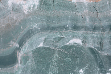 Rock formation, stone in section. Patterns on the stone. Background with cut stone close up