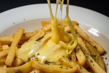 French fries are dishes made from pieces of potatoes fried in hot cooking oil. French fries are cut into lengths and fried in a submerged state in hot cooking oil called French fries