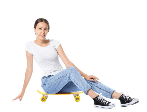 Beautiful Young Woman With Skateboard On White Background