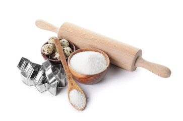 Ingredients for cookies and rolling pin on white background