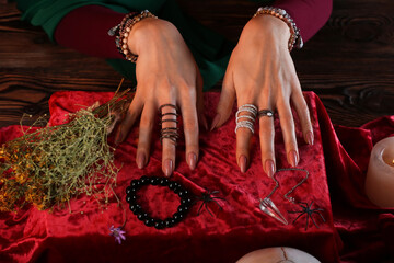 Fortune teller reading future at table