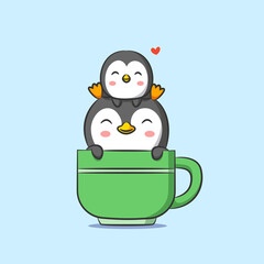 The small and big penguin is sitting on the tea cup with the green color