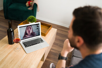 Pretty woman sending a kiss to her husband through the screen