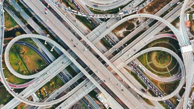 Aerial view of the cars driving on multi-level highway in Bangkok city,  direct above to the road traffic in a big city in rush hour